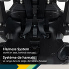 Detail view of the harness storage system tucked neatly behind the seat pad for booster mode transitions.