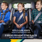 Three children sitting side-by-side in Safety 1st EverSlim car seats across the back seat of a car.